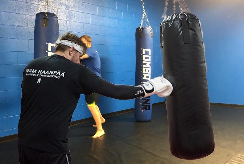 Fitness kickboxing class working pads at Team Haanpaa Martial Arts